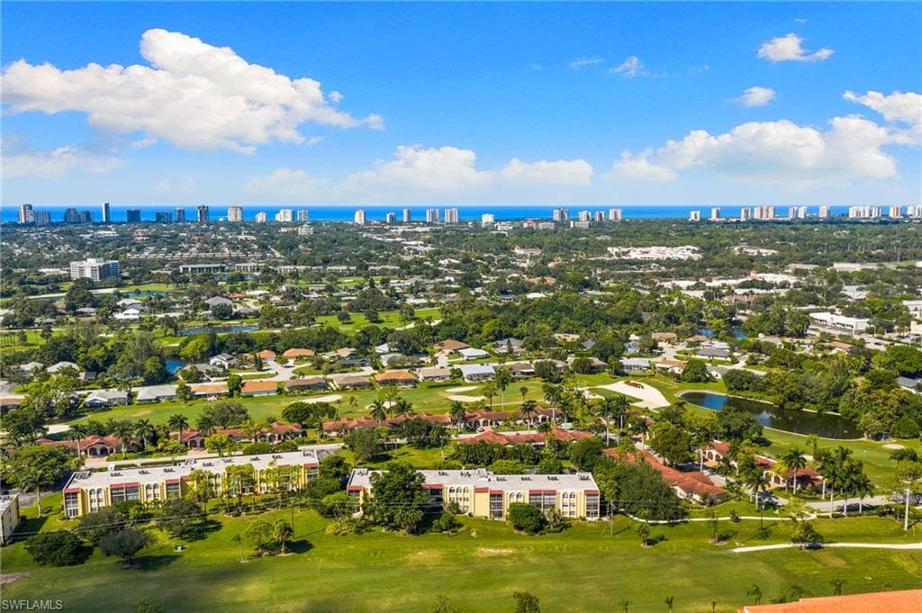 View of urban area with a nearby body of water and a local golf course