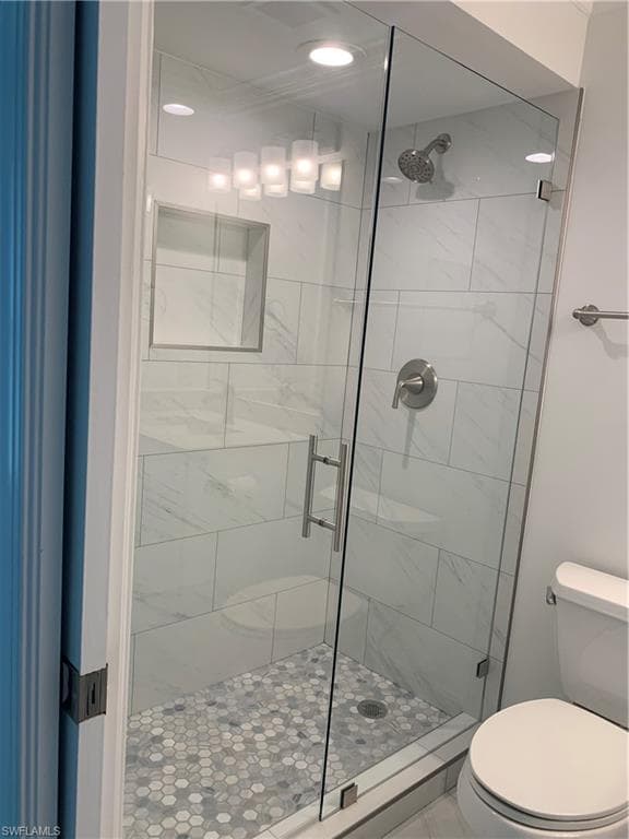 On suite Primary bath featuring large shower area