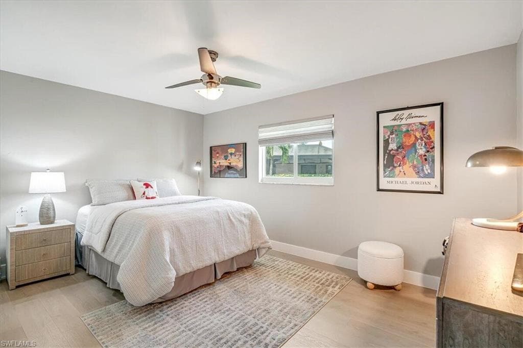 Bedroom featuring light wood-style floors and a ceiling fan