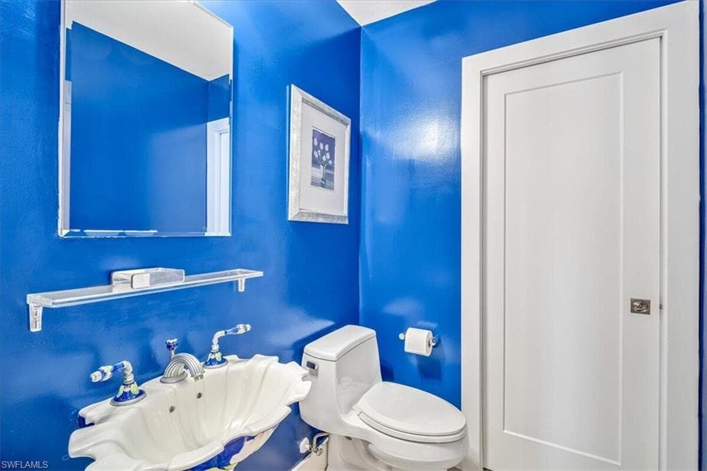 Bathroom featuring toilet and a sink