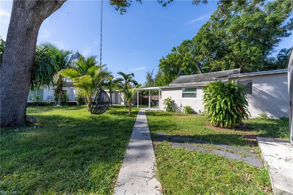 View of front of home featuring a front lawn