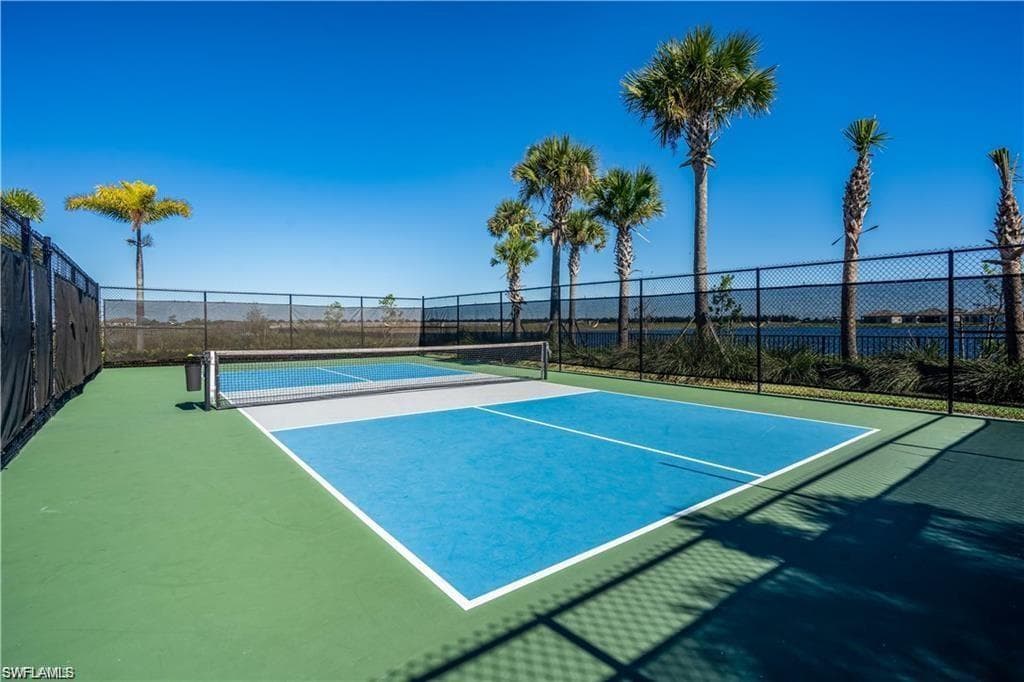 View of tennis court featuring community basketball court