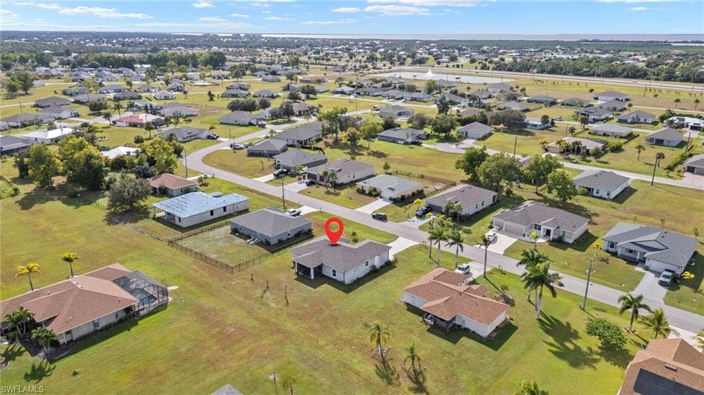 Aerial overview of property's location with nearby suburban area