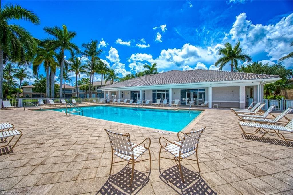 Community pool with a patio area