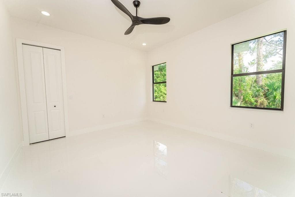 Unfurnished bedroom with recessed lighting, a ceiling fan, and a closet