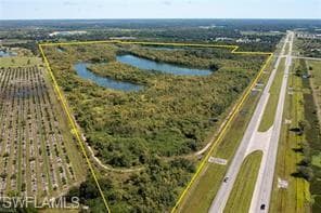 Overview of rural landscape featuring property boundaries highlighted and rows of crops