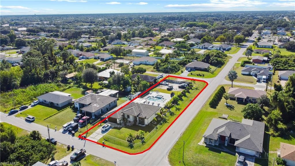 Aerial view of residential area with property boundaries highlighted