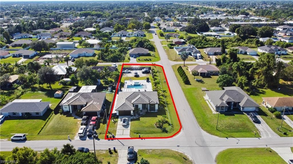 Aerial perspective of suburban area with property boundaries highlighted