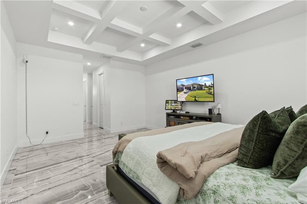 Bedroom featuring coffered ceiling, beam ceiling, recessed lighting, and light marble finish floors