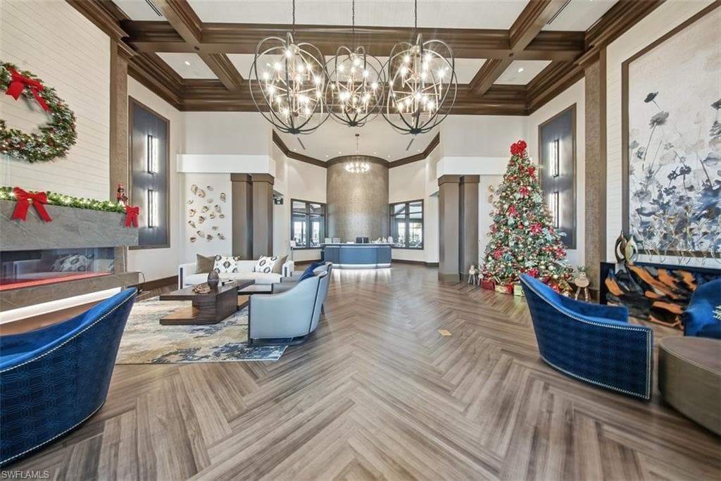 Building lobby with beamed ceiling, coffered ceiling, and a towering ceiling