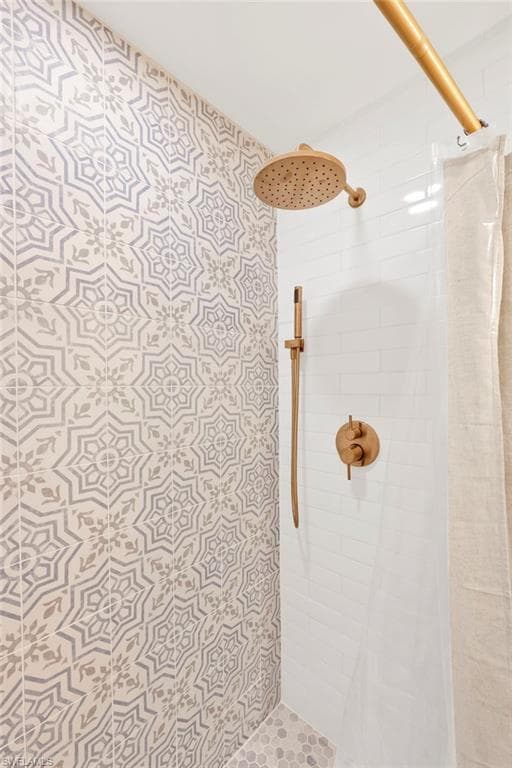 Bathroom featuring a shower stall