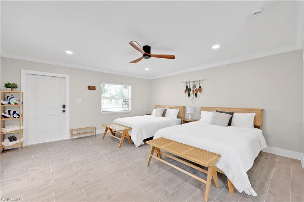 Bedroom featuring ornamental molding, wood tiled floors, ceiling fan, and recessed lighting