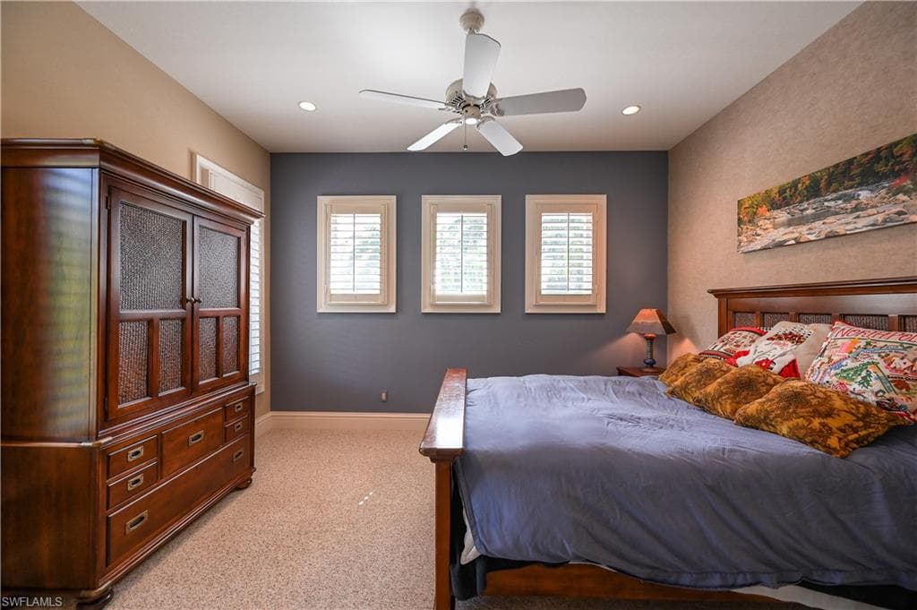 Guest apartment Bedroom with light colored carpet, a ceiling fan, and recessed lighting