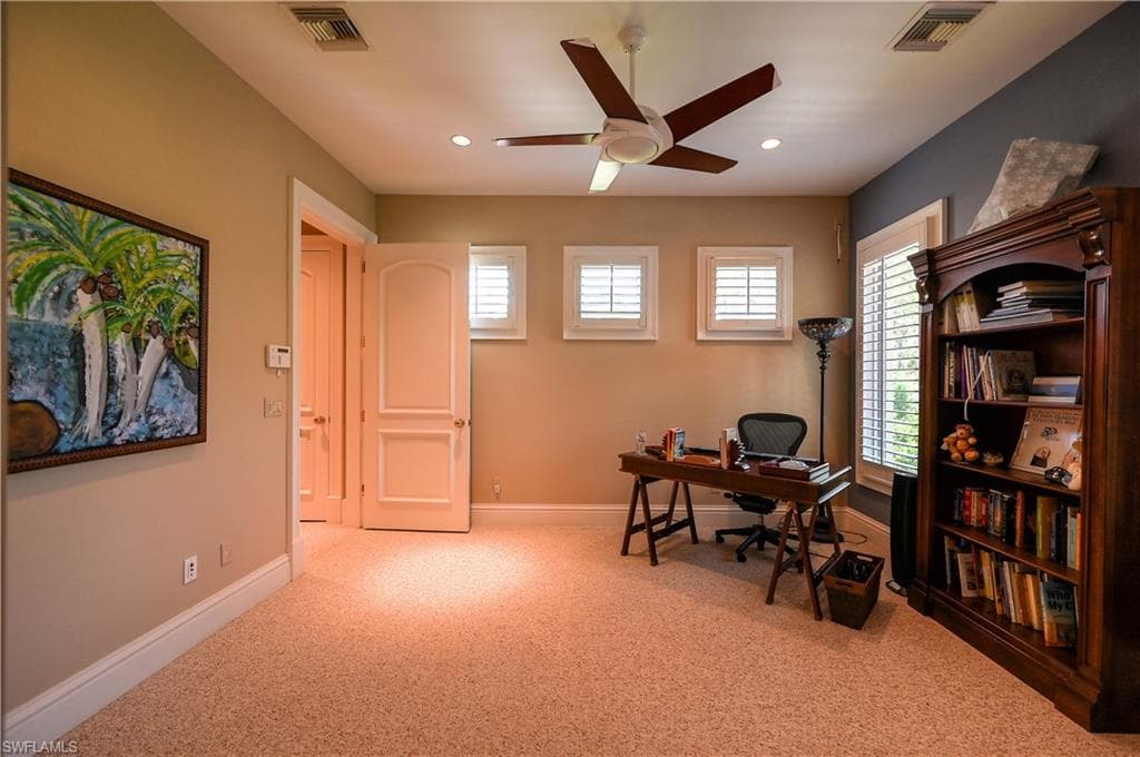 Guest apartment Office space with a ceiling fan, light carpet, and recessed lighting