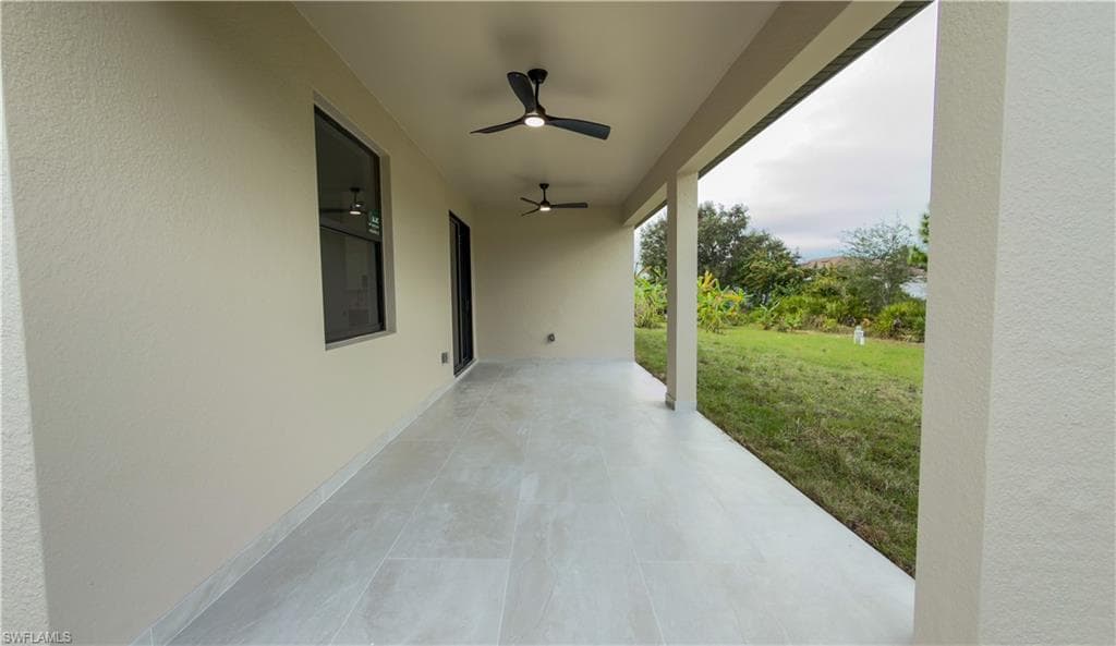 View of patio featuring ceiling fan