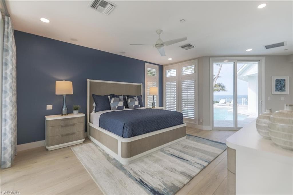 Bedroom with ceiling fan, light hardwood / wood-style flooring, and access to outside