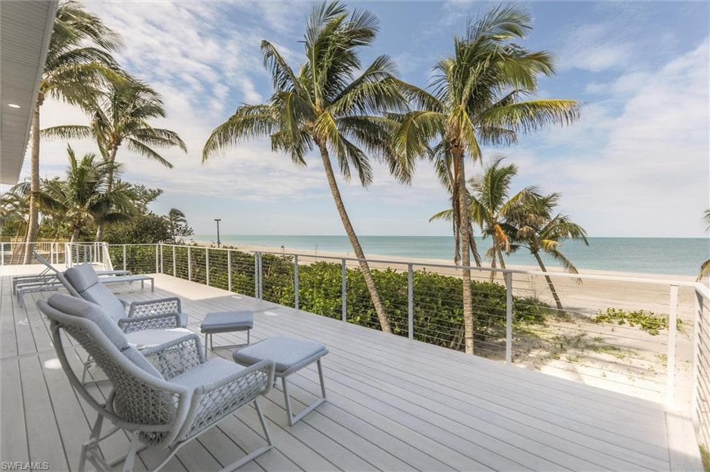 Wooden terrace featuring a water view
