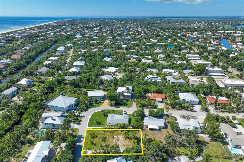 View of property location featuring a large body of water and property boundaries highlighted