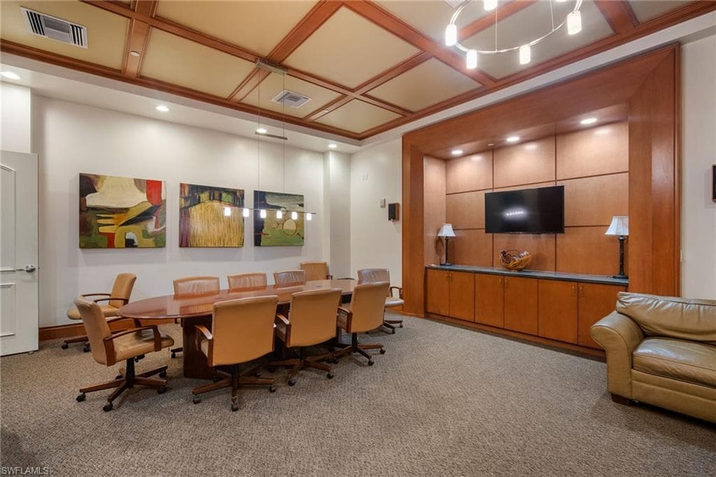 Office space featuring coffered ceiling and recessed lighting