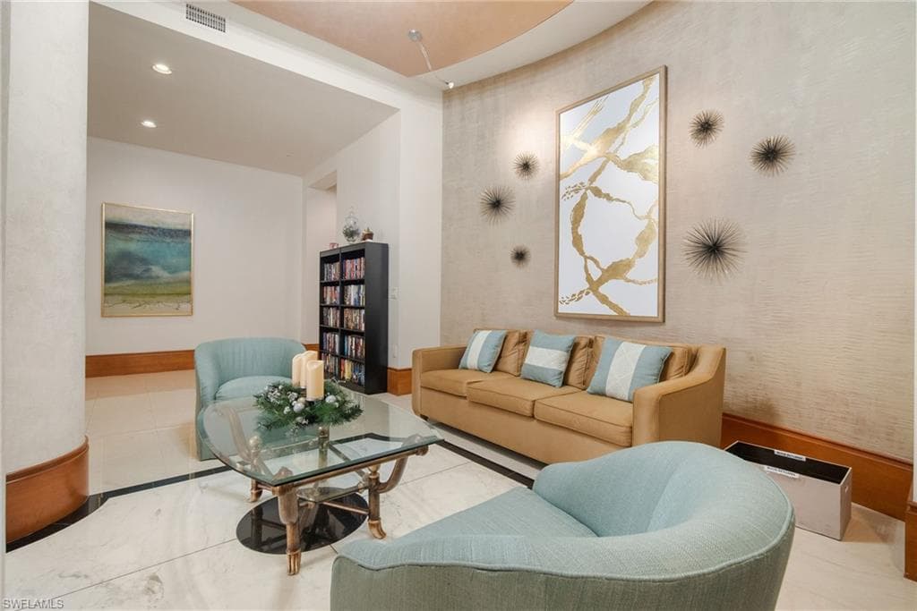 Living room with recessed lighting and baseboards
