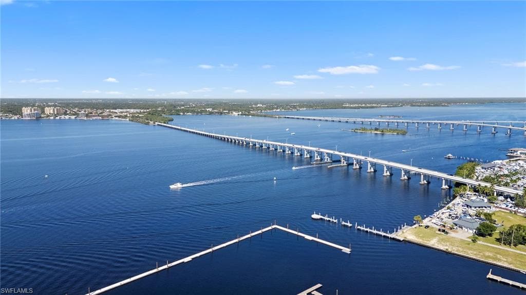 Bird's eye view of a notable bridge and a nearby body of water