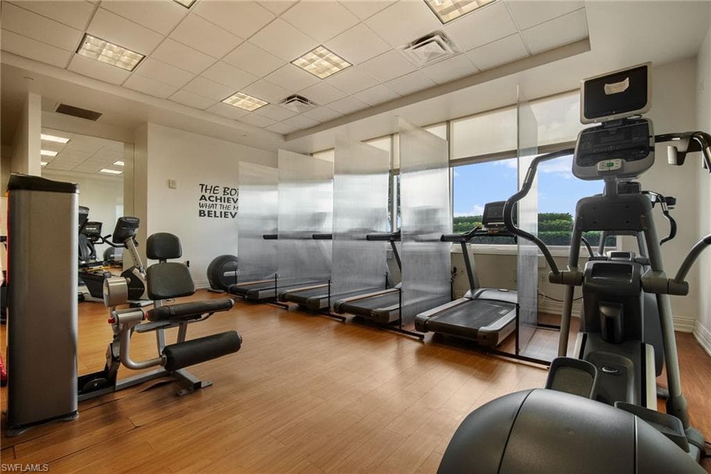 Workout area featuring a paneled ceiling