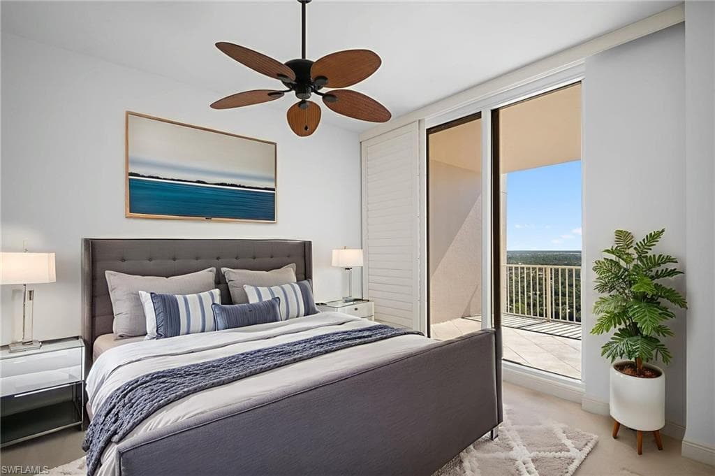 Carpeted bedroom with access to exterior and ceiling fan