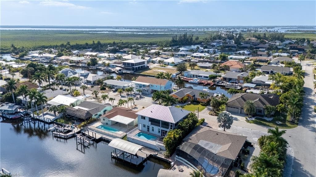Aerial view of residential area with a nearby body of water