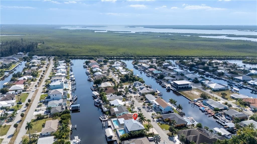 Aerial perspective of suburban area with a large body of water