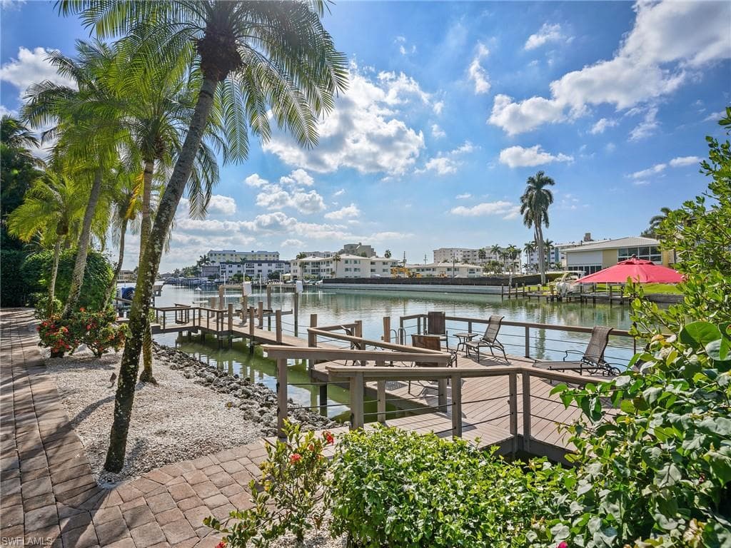 Dock with boat lift and a water view