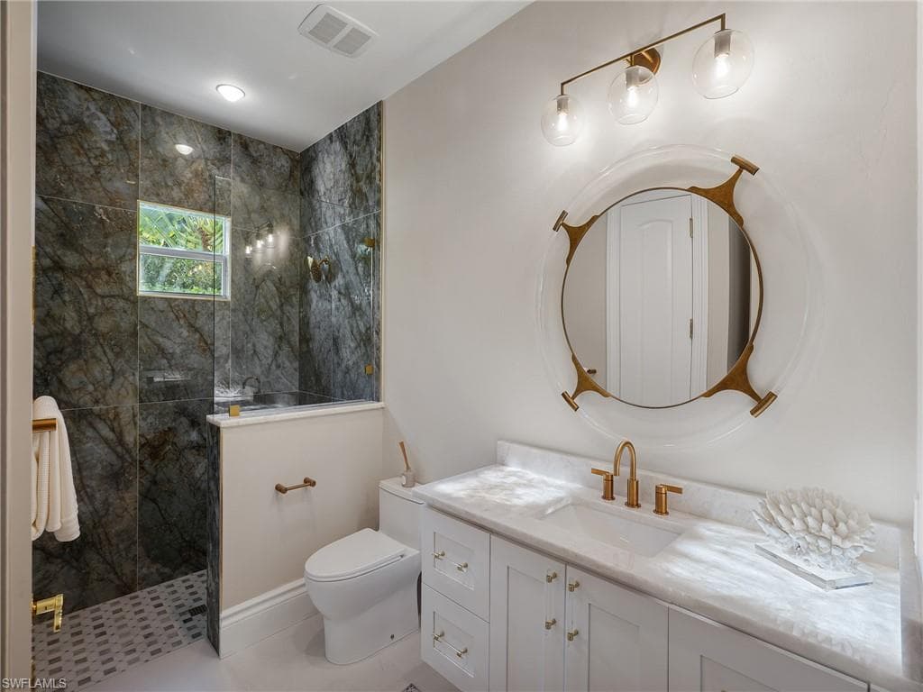 Bathroom with a walk in shower and vanity