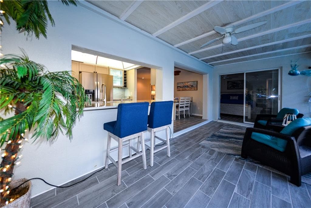 Pass through window from Kitchen to Florida Room - porcelain tile flooring
