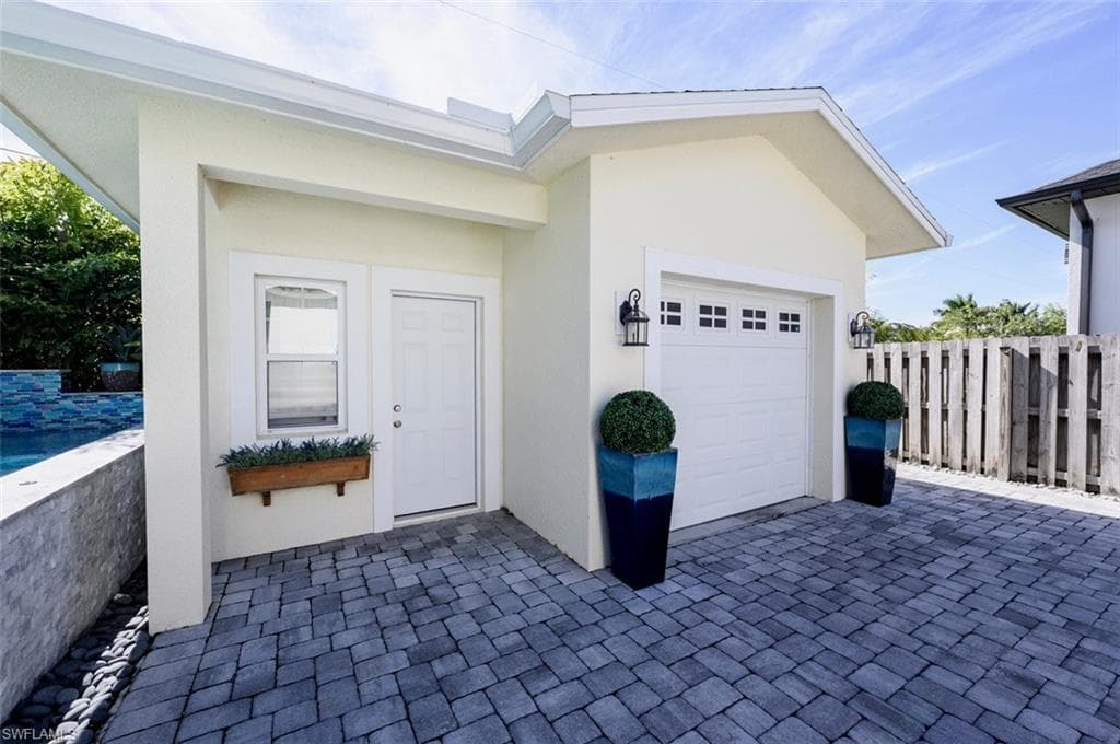 Detached garage, behind gated fence