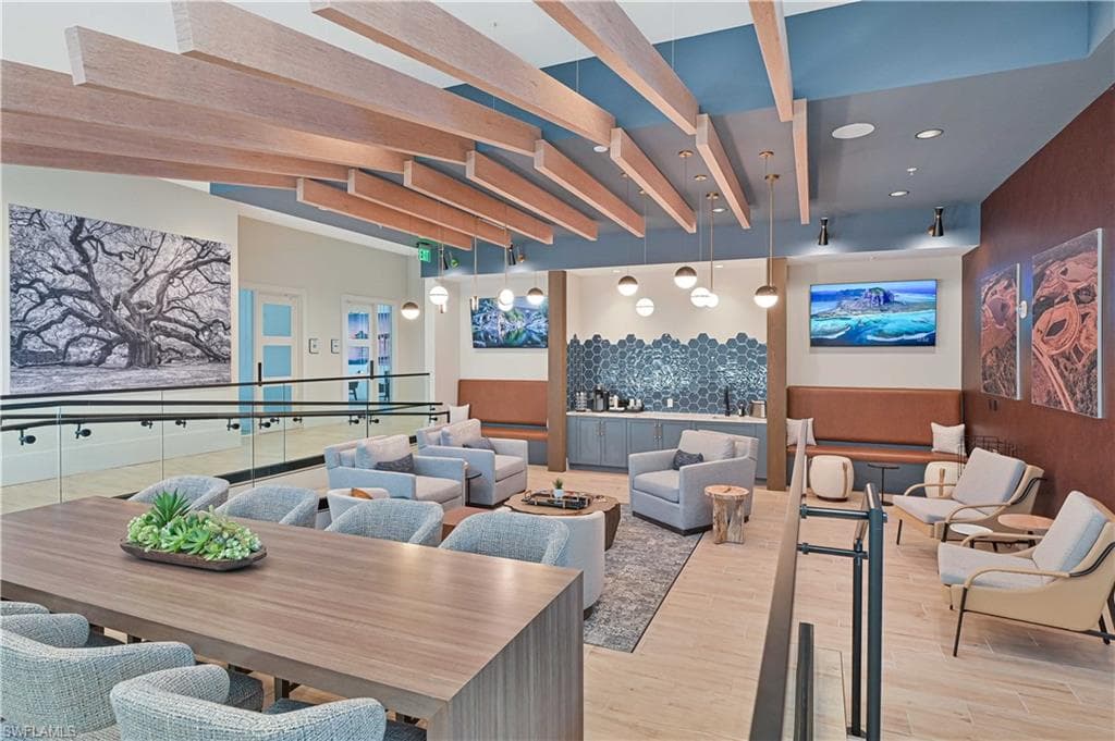 Building lobby with beamed ceiling and recessed lighting