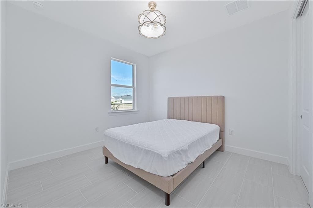 Bedroom featuring baseboards