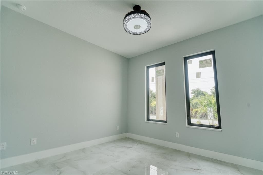 Unfurnished room with marble finish flooring