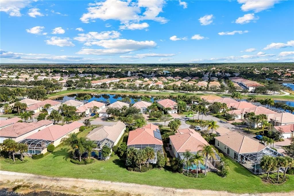 Aerial perspective of suburban area with a nearby body of water
