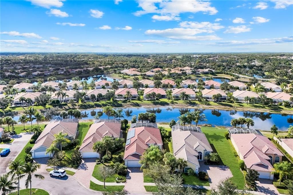 Aerial perspective of suburban area featuring a large body of water