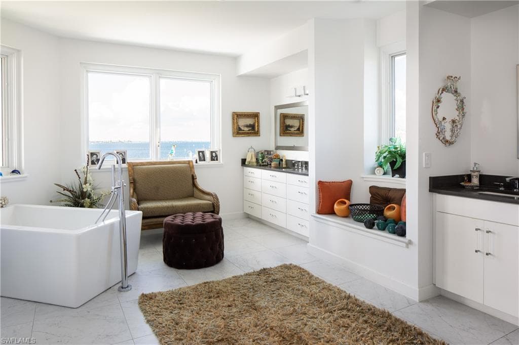 Living area with light marble finish flooring