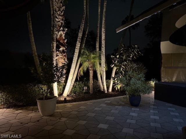 Patio at twilight featuring a patio area