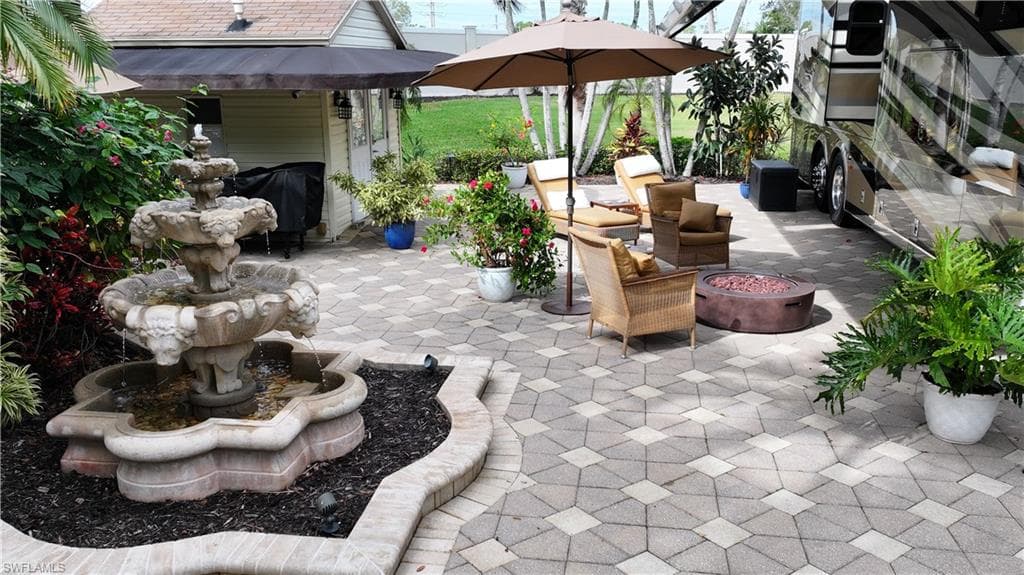 View of patio / terrace with an outdoor fire pit