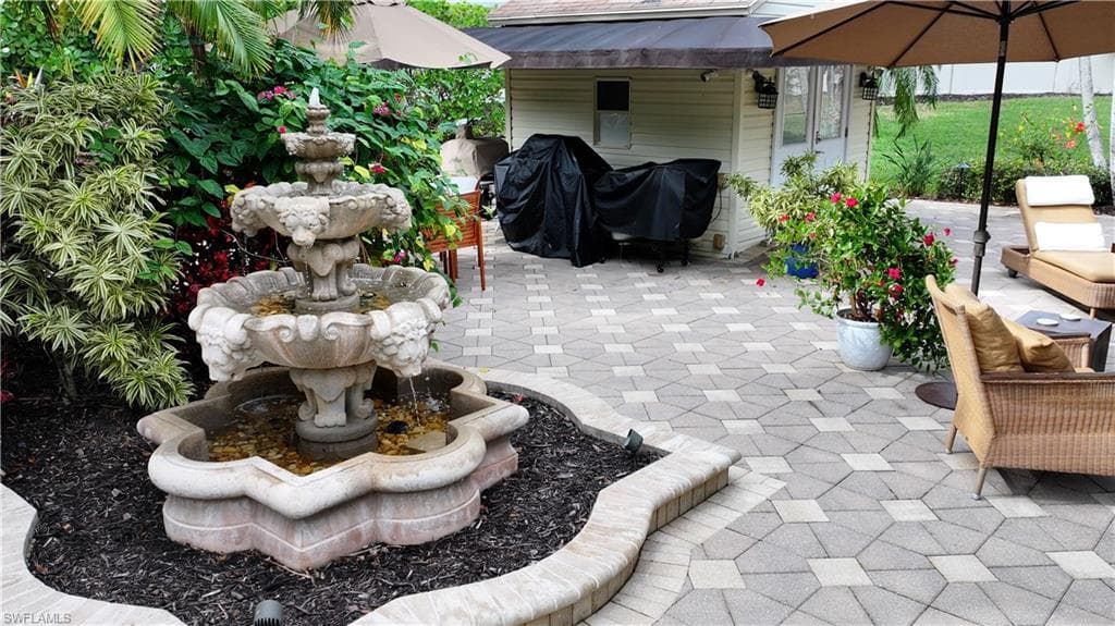 View of patio featuring area for grilling