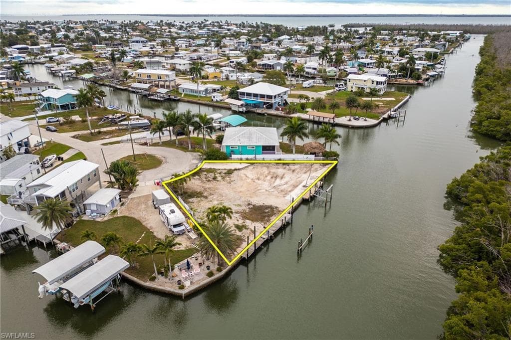 Aerial perspective of suburban area featuring property parcel outlined