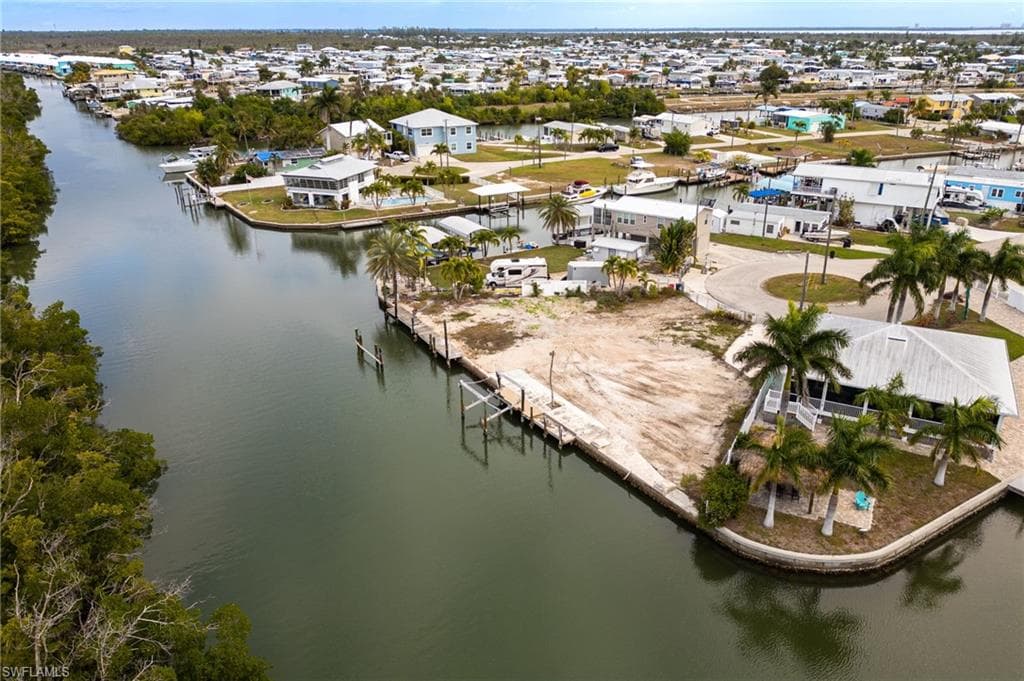 Aerial view of residential area with a view of canal and seawall area