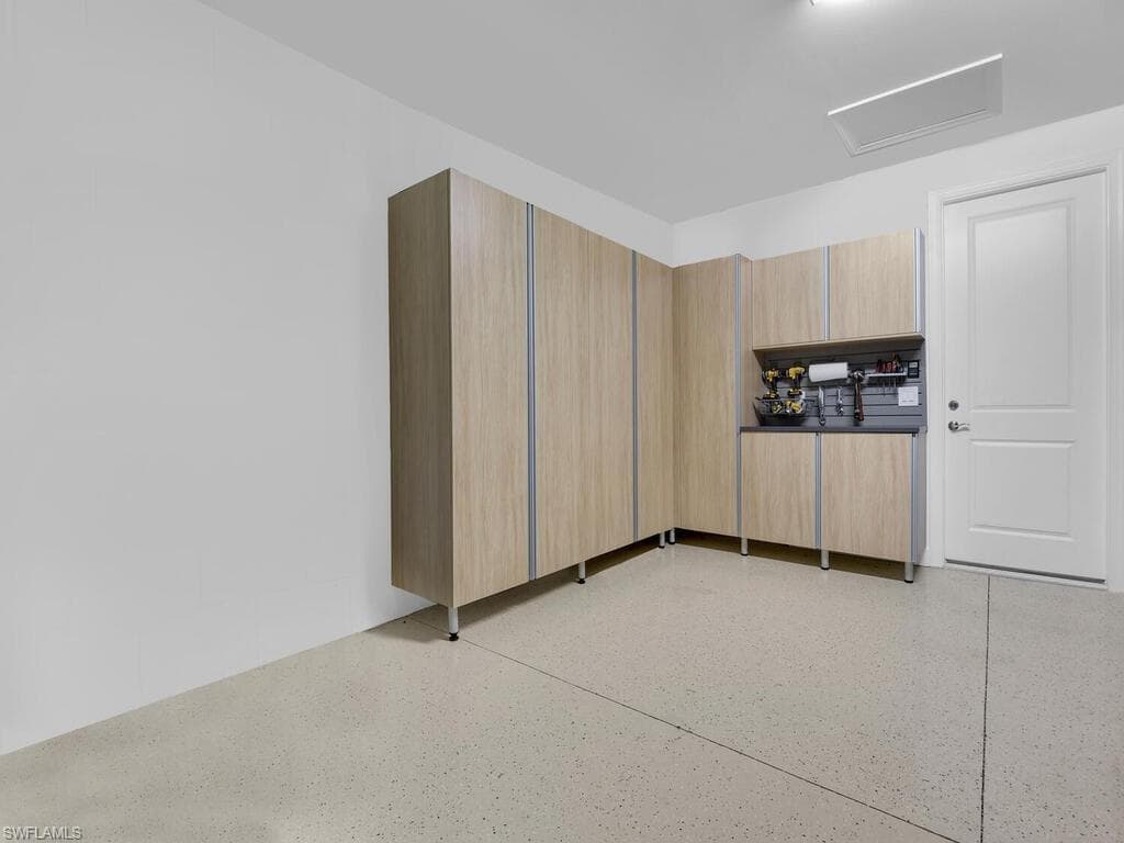 2 Car Garage with Custom Cabinetry for Storage
