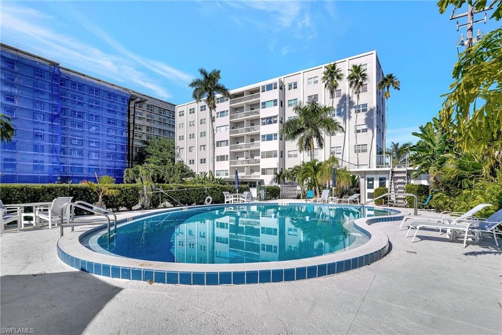 Enjoy heated community heated pool and BBQ patio - your condo is on top left corner