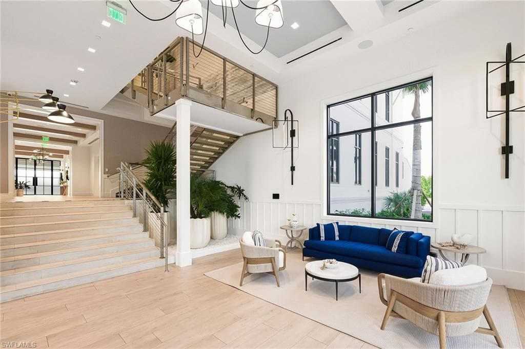 Building lobby with stairway and a wainscoted wall