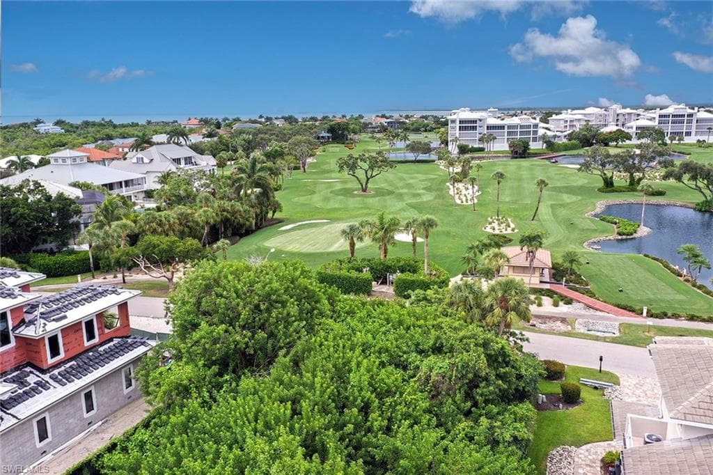 Bird's eye view of a local golf course and a large body of water