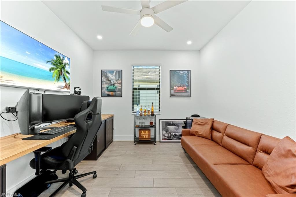 Office featuring wood tiled floors, ceiling fan, and recessed lighting
