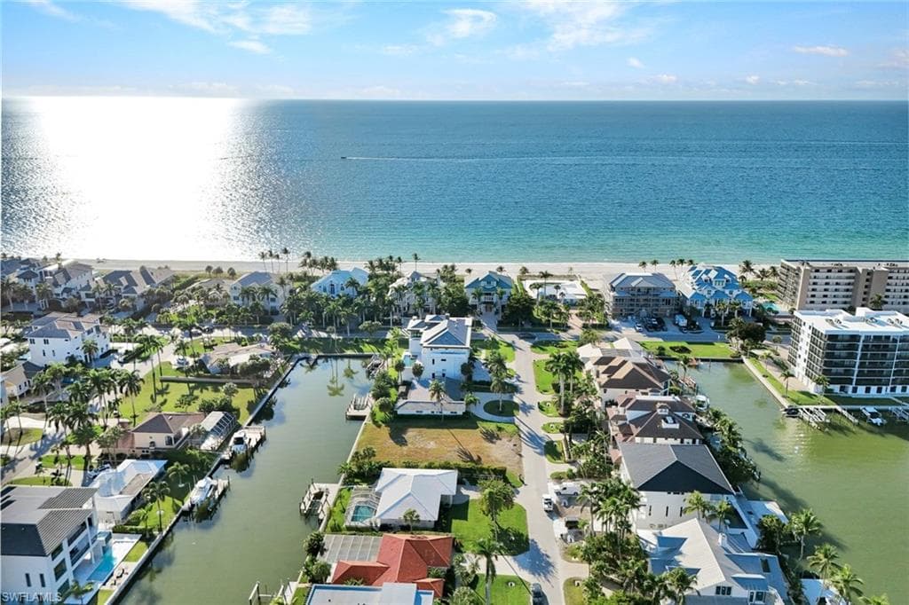 Aerial view of residential area with a large body of water